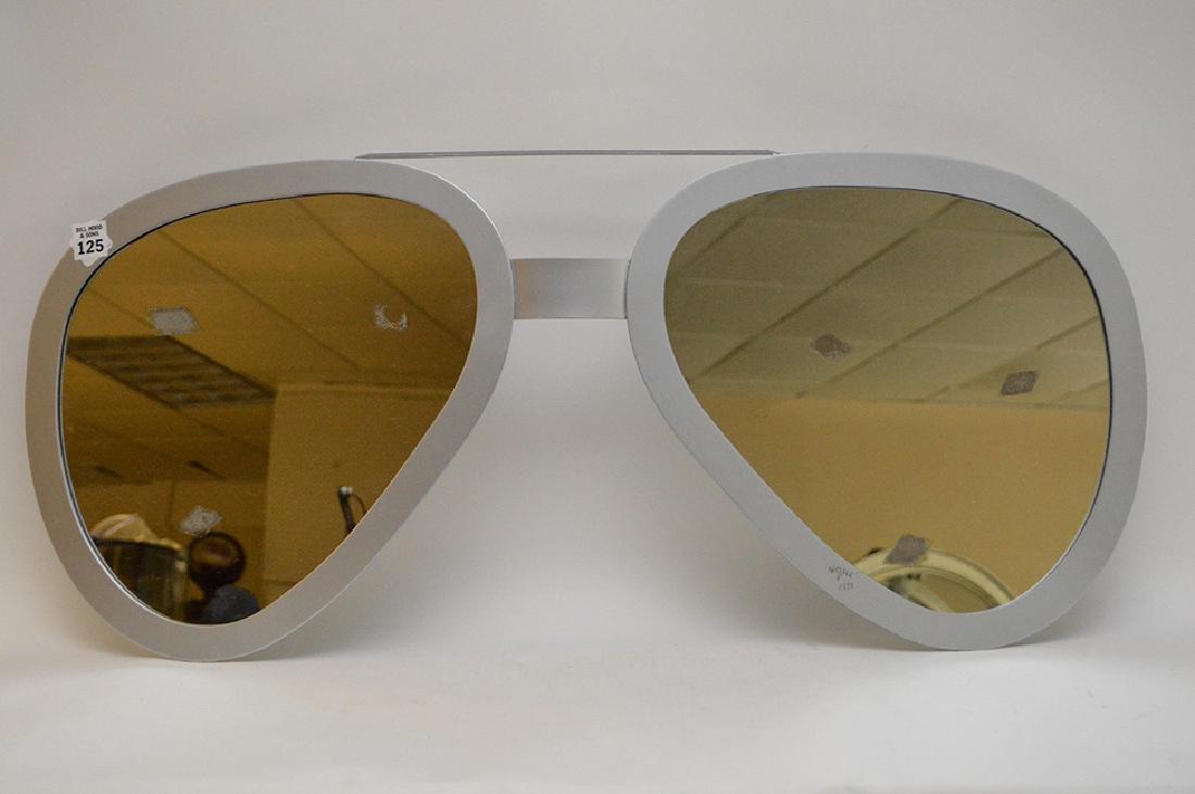 CURTIS JERE signed 1980, silver painted metal aviator: CURTIS JERE signed 1980, silver painted metal aviator glasses-shaped hanging mirror Ink signature 14 x 31 inches