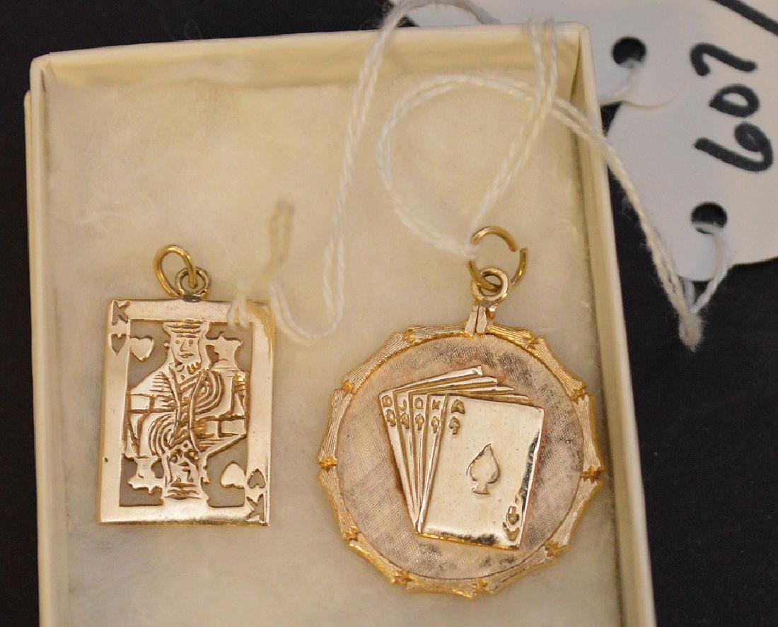 2 14K YELLOW GOLD CARD PENDANT. One royal flush 1 1/8": 2 14K YELLOW GOLD CARD PENDANT. One royal flush 1 1/8" and one king of spades 1" x .75" . Weight 10.2 grams