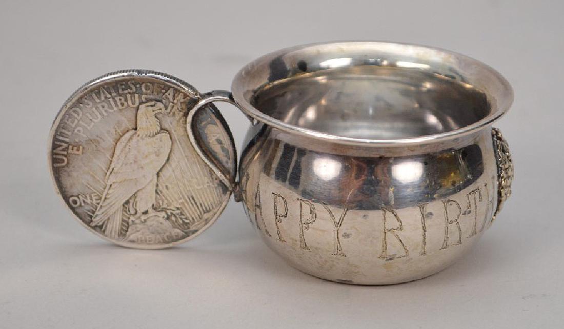 Sterling Memorabilia Happy Birthday cup with 1921: Sterling Memorabilia Happy Birthday cup with 1921 Liberty Dollar, monogram inside bottom, 1 1/4"h x 3 1/2"w Shipping: Our Gallery offers shipping for this item. To inquire call or text Maria at 561-35