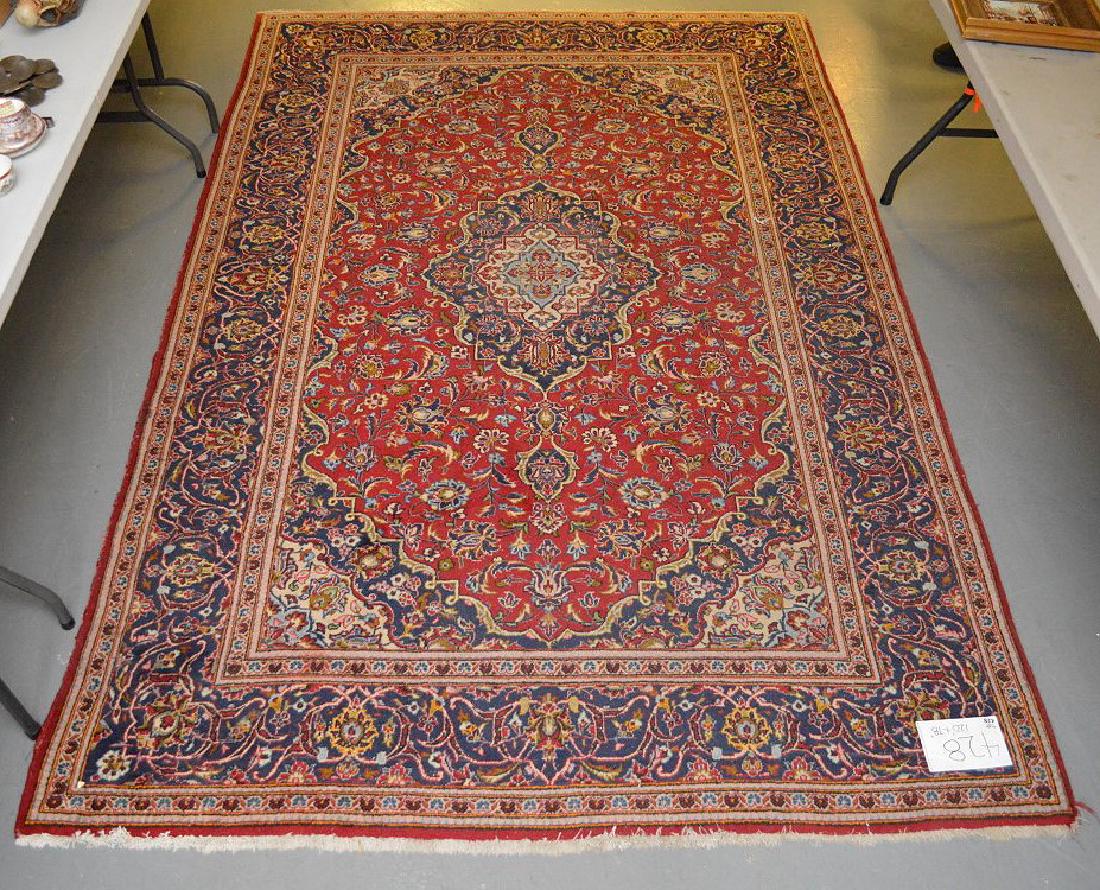 Sarouk carpet, dark blue border and red center with (1 of 5)