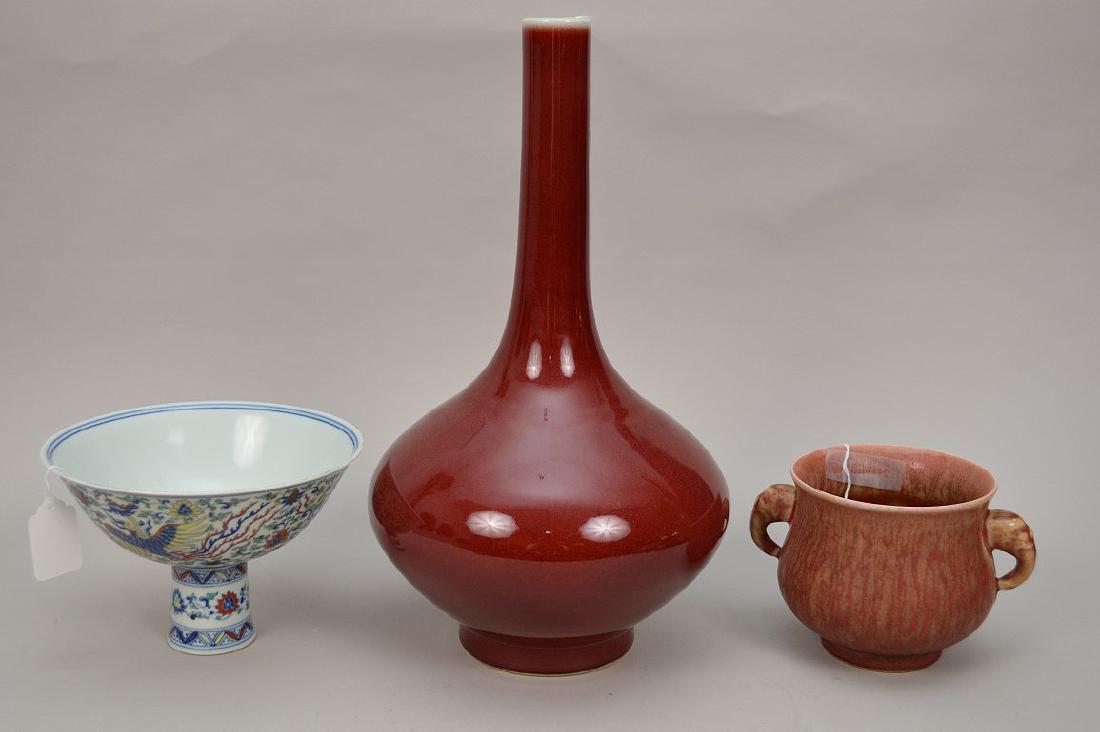 3 CHINESE PROCELIAN ARTICLES. 1 Chinese red ox blood: 3 CHINESE PROCELIAN ARTICLES. 1 Chinese red ox blood porcelain vase ( base has been drilled to be a lamp) 14.5" Height. 1 Chinese porcelain pedestal bowl Famille rose decoration 6 character mark size 