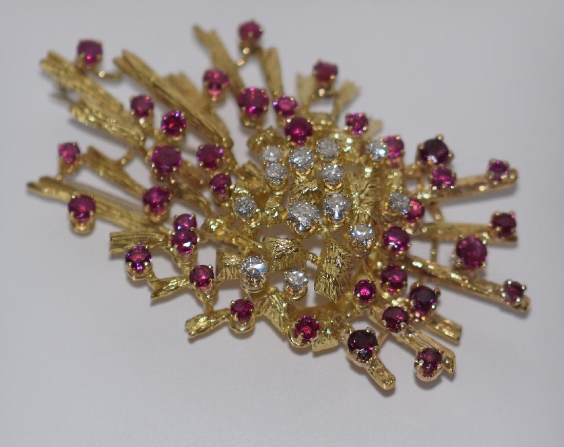 18kt yellow gold diamond & ruby brooch, approx. 2.4: 18kt yellow gold diamond & ruby brooch, approx. 2.4 ct. round brilliant cut diamonds, AND approx. 5 ct round cut rubies, 24.6 dwt, 2 1/2" x 1 3/4" This item is available for in house shipping contact