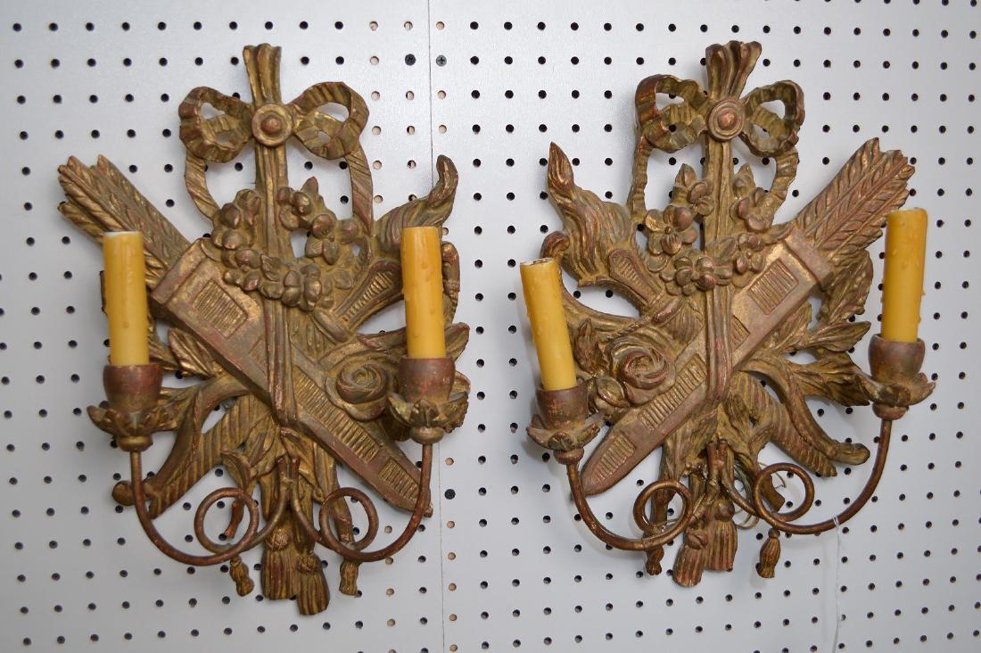Pair Italian Carved Giltwood 2 Light Sconces.: Pair Italian Carved Giltwood 2 Light Sconces. Condition: good with minor normal wear and electrified. Height 17" Width 11" Depth. 5"