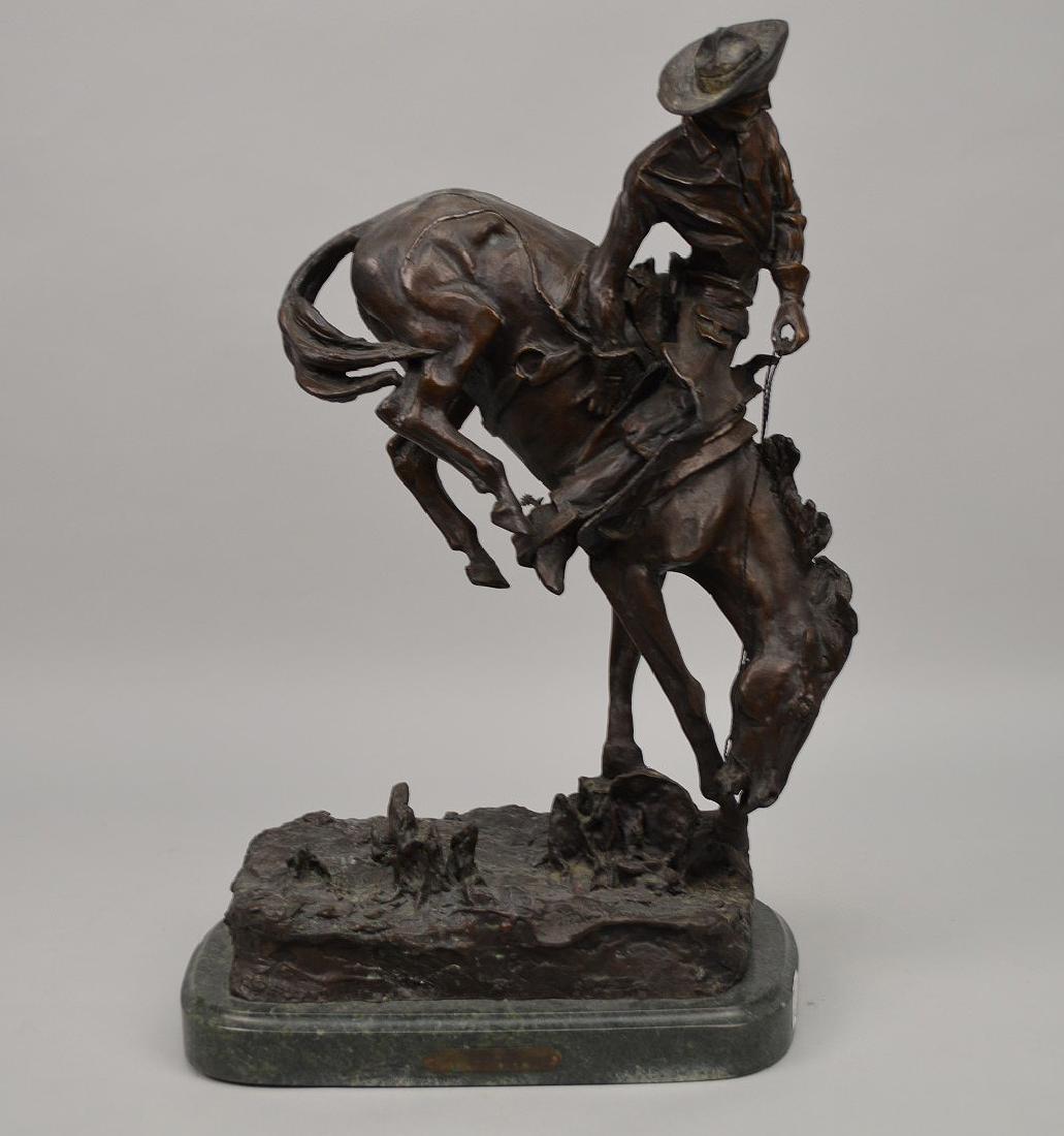 After Frederic Remington Bronze sculpture OUTLAW: After Frederic Remington Bronze sculpture OUTLAW mounted on a green marble base?Signed and titled under horse’s mouth, “Outlaw – Frederic Remington”?Said to be an edition of 100?H. 22” x W. 
