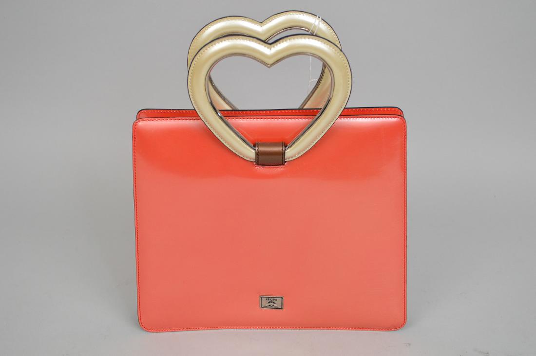 Moschino Multicolor Leather with Heart Handles. 9" x: Moschino Multicolor Leather with Heart Handles. 9" x !0" with 5" Heart Handles overall good condition. This item is available for in house shipping contact Maria 561-351-2013 or email gidgett63@gmail.