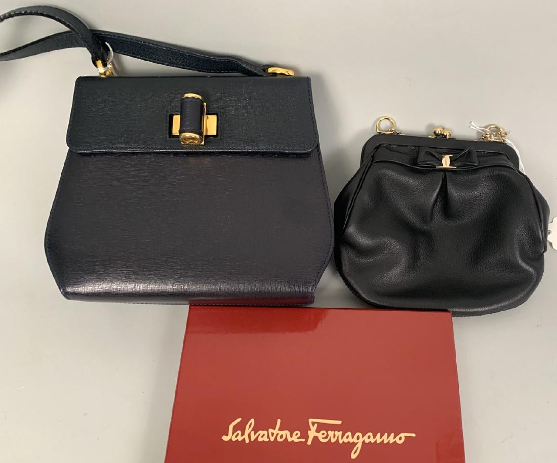 2 Small Salvatore Ferragamo Bags Color Dark Blue &: 2 Small Salvatore Ferragamo Bags Color Dark Blue & Black. Dark Blue 6.5" x 7.5 " with 20" strap Condition good no flaws. Black with snap closure 6" x 6" double gold change handle 4" no flaws. This ite