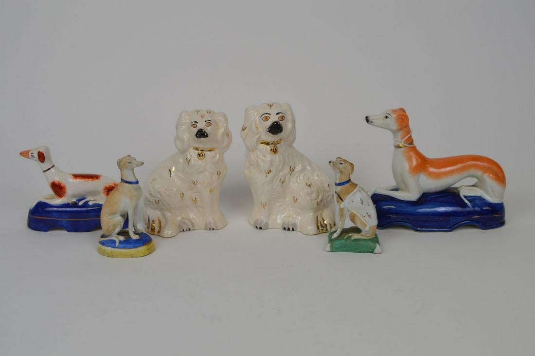6 Staffordshire dogs, Pair of Spaniels, 2 Bisque seated: 6 Staffordshire dogs, Pair of Spaniels, 2 Bisque seated Whippets And 2 reclining dogs on cobalt color pillows