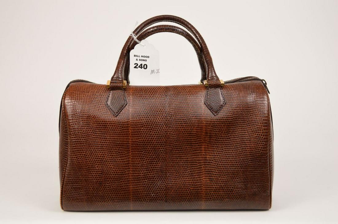 Lot of Two Designer Purses. A Large Vintage Lizard: Lot of Two Designer Purses. A Large Vintage Lizard Koret Doctor’s Bag, 12” w-7 ½”h (13” top of handles)-7” depth. Together with a Fine Black Vintage large Bill Blass Hobo Bag with Fine Leat