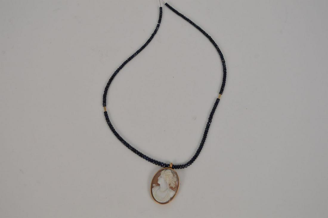 ANTIQUE GOLD CAMEO SET: ANTIQUE GOLD CAMEO SET in gold with Cambodian AAA graded Sapphires. The Sapphire ranging from 2mm to 4mm. Condition: no issues identified.