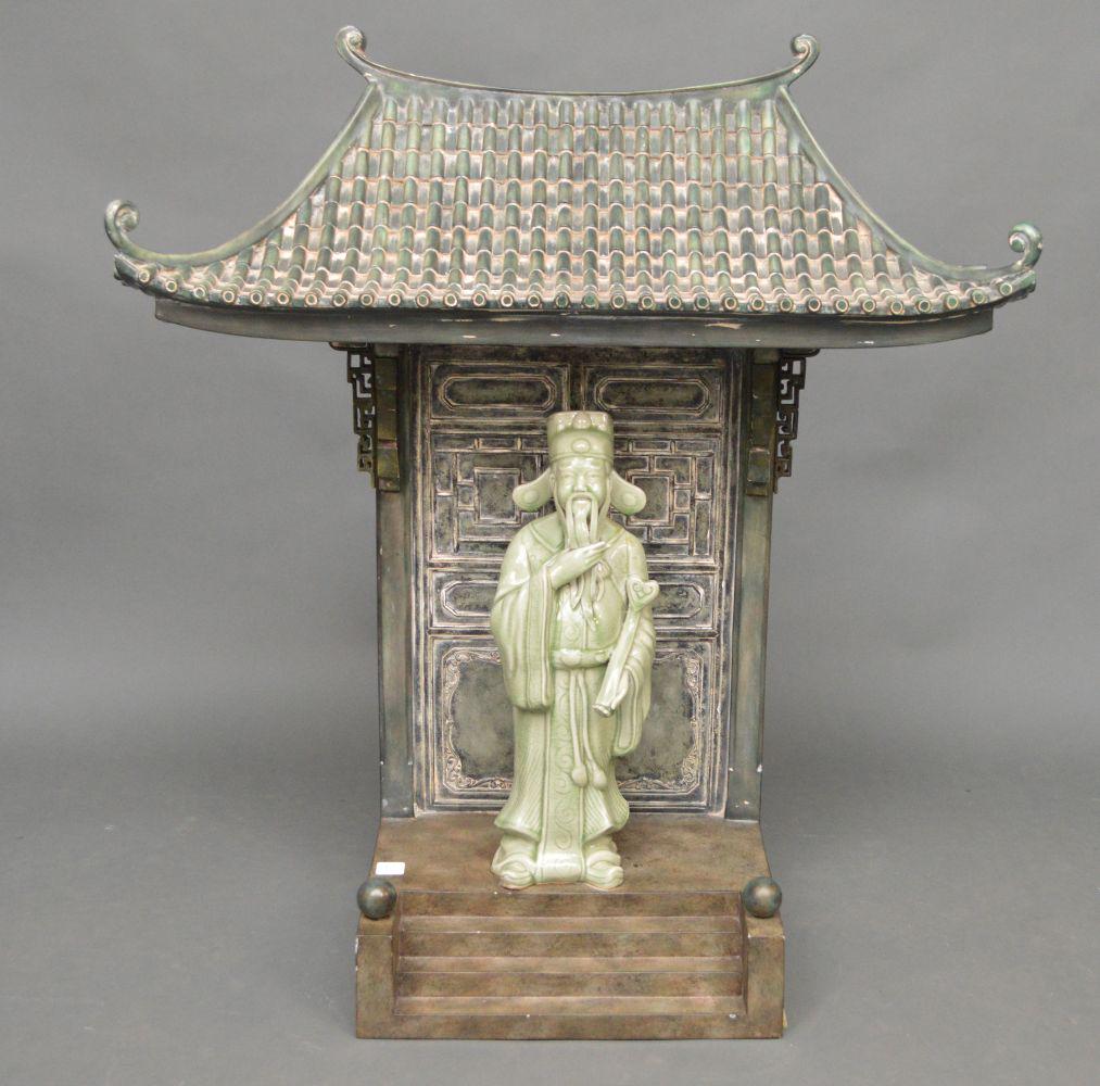 MAITLAND SMITH BRONZE & PORCELAIN GROUP depicting a: MAITLAND SMITH BRONZE & PORCELAIN GROUP depicting a Chinese wiseman standing in a pagoda doorway. Condition: no issues identified. H. 34" W. 30" d. 10"