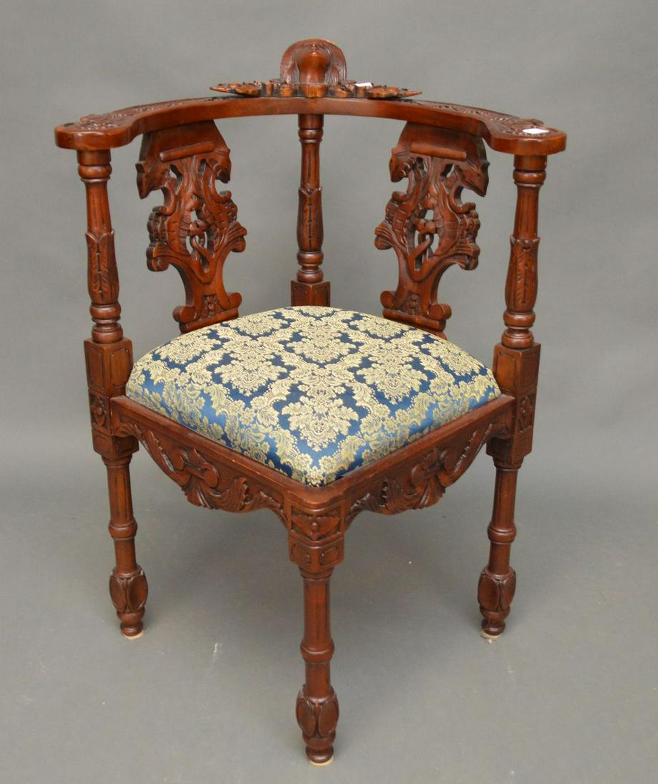 Heavily carved corner chair, upholstery matches above: Heavily carved corner chair, upholstery matches above item