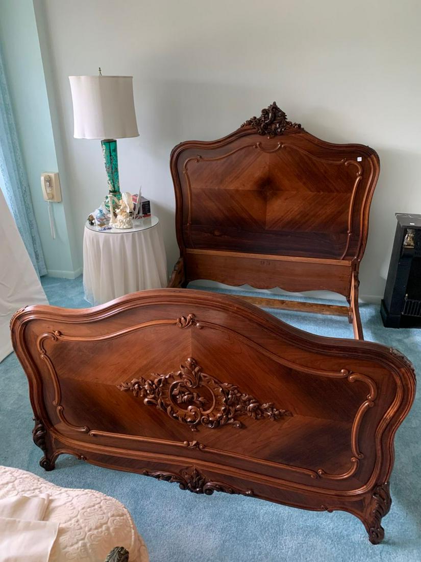 French Louis XV style rosewood parquetry bed, the: French Louis XV style rosewood parquetry bed, the headboard with curved top rail centered with acanthus leaf carved crest, headboard and footboard with carved floral, foliate and scroll designs raised
