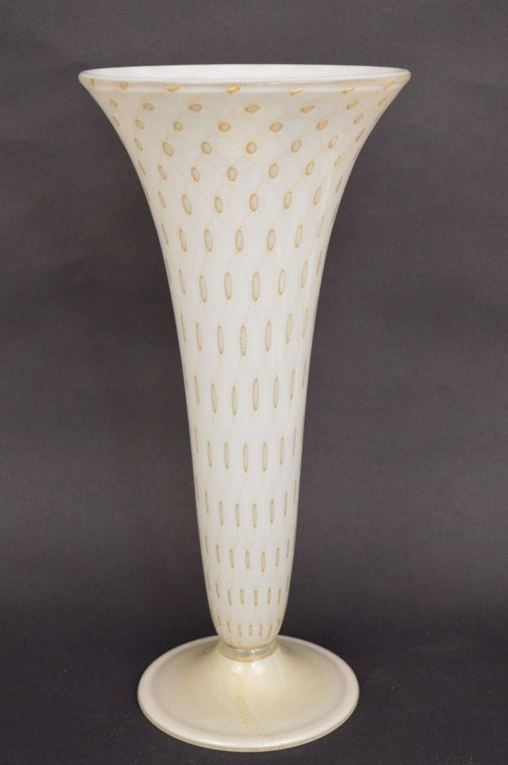 Murano hand blown glass vase, Bullicante encased in: Murano hand blown glass vase, Bullicante encased in clear glass over opaque white glass with gold inclusions. The trumpet shaped footed vase is 14” high and appears to be in excellent condition.