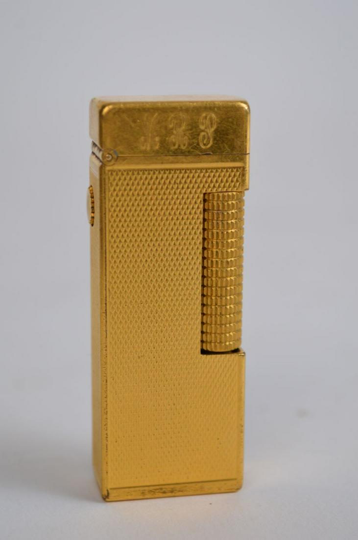 Dunhill Gold Tone Lighter. Condition normal wear has: Dunhill Gold Tone Lighter. Condition normal wear has initials on top MRP