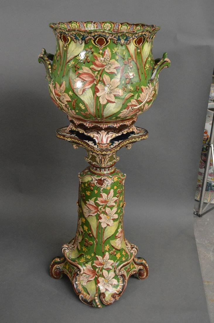 ROYAL BONN PORCELAIN JARDINIERE & PEDESTAL, circa 1890: ROYAL BONN PORCELAIN JARDINIERE & PEDESTAL, circa 1890 and 1920, made by Franz Anton Mehlen, German urn on stand, Â“Old Dutch”, green ground with floral motif, urn 16” H. x 15.75”, stand 29��