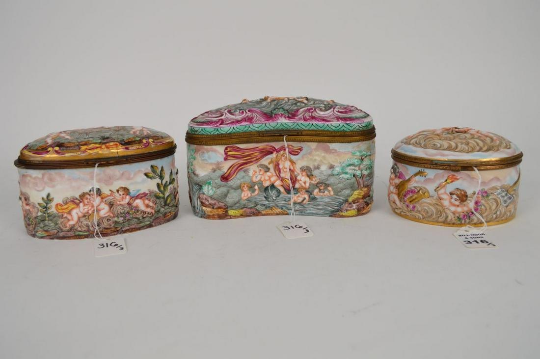 3 CAPODIMONTE PORCELAIN BOXES. 1 Kidney Shaped Box: 3 CAPODIMONTE PORCELAIN BOXES. 1 Kidney Shaped Box Ht. 4 7/8" Wth. 7 7/8" Depth 4", 1 Oval Box with angels on a cloud top. Ht. 3 1/2" Width 5" Depth 4", 1 Oval Box Height 4" Width 6 1/4" Depth 4" (thi