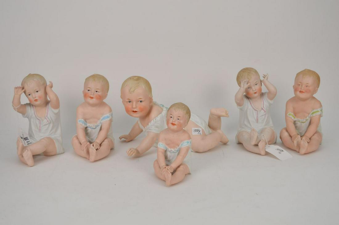 6 Bisque babies, Germany, crawling (8"h x 12"w), AND 4: 6 Bisque babies, Germany, crawling (8"h x 12"w), AND 4 seated babies (8 1/2"h) and another (6 1/2"h)