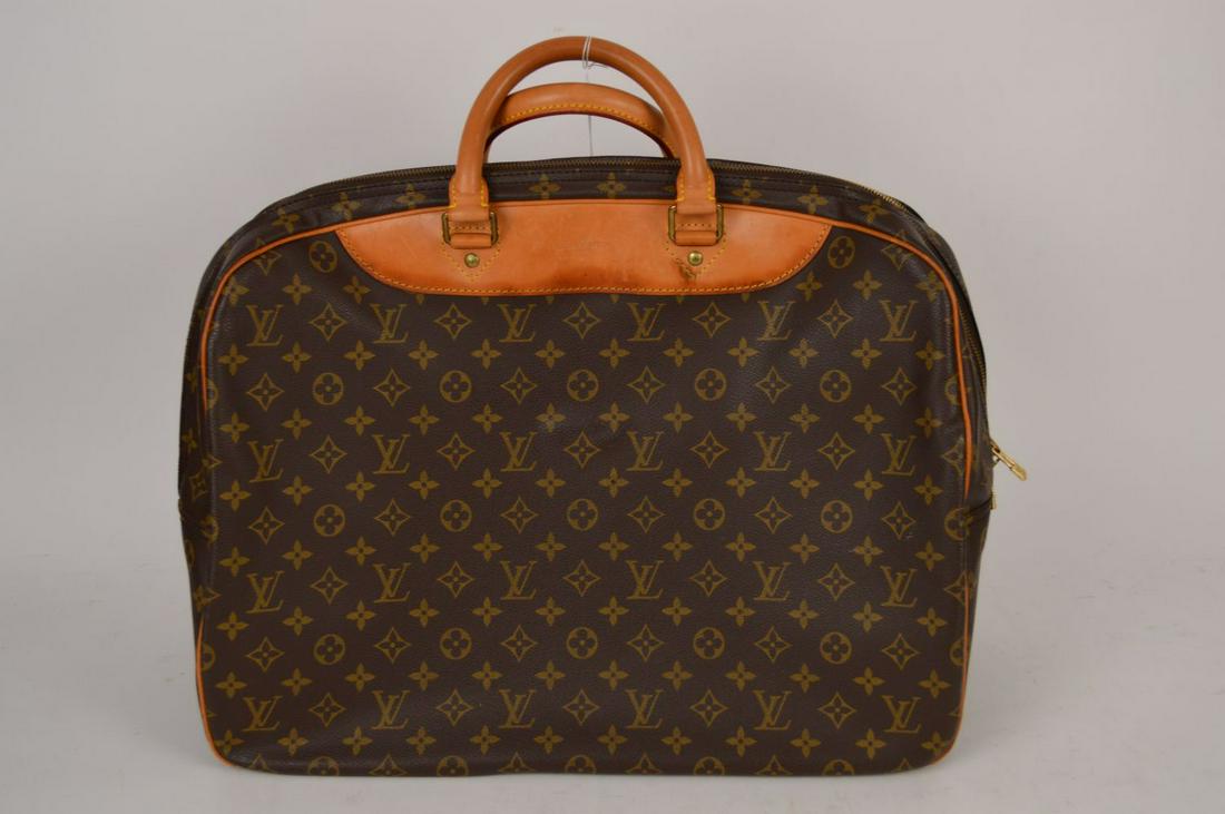 Vintage Louis Vuitton Travel Bag. 18" L 14" H with: Vintage Louis Vuitton Travel Bag. 18" L 14" H with Strap 17.5" 2 Compartment 8" depth shows some wear part of inside lining coming lose