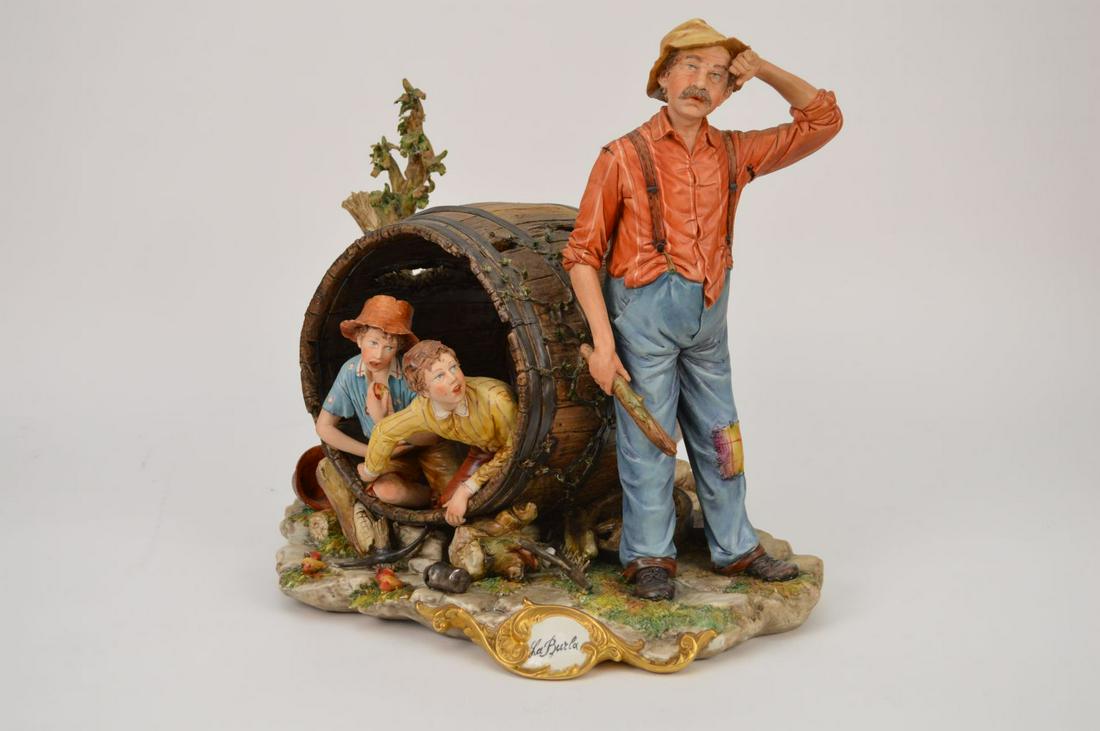 Capodimonte Porcelain Group "Huck Finn" grouping of: Capodimonte Porcelain Group "Huck Finn" grouping of children hiding in barrel, "La Burla"