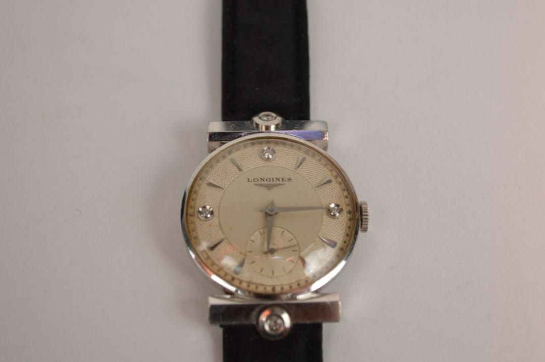 Longines 14k White Gold Diamond Men's Wrist Watch.: Longines 14k White Gold Diamond Men's Wrist Watch. Watch case and buckle are 14k marked and tested. 3 Diamond White 2 tone face, clear crystal 35mm including lugs. Leather band c. 1954 thought to be L