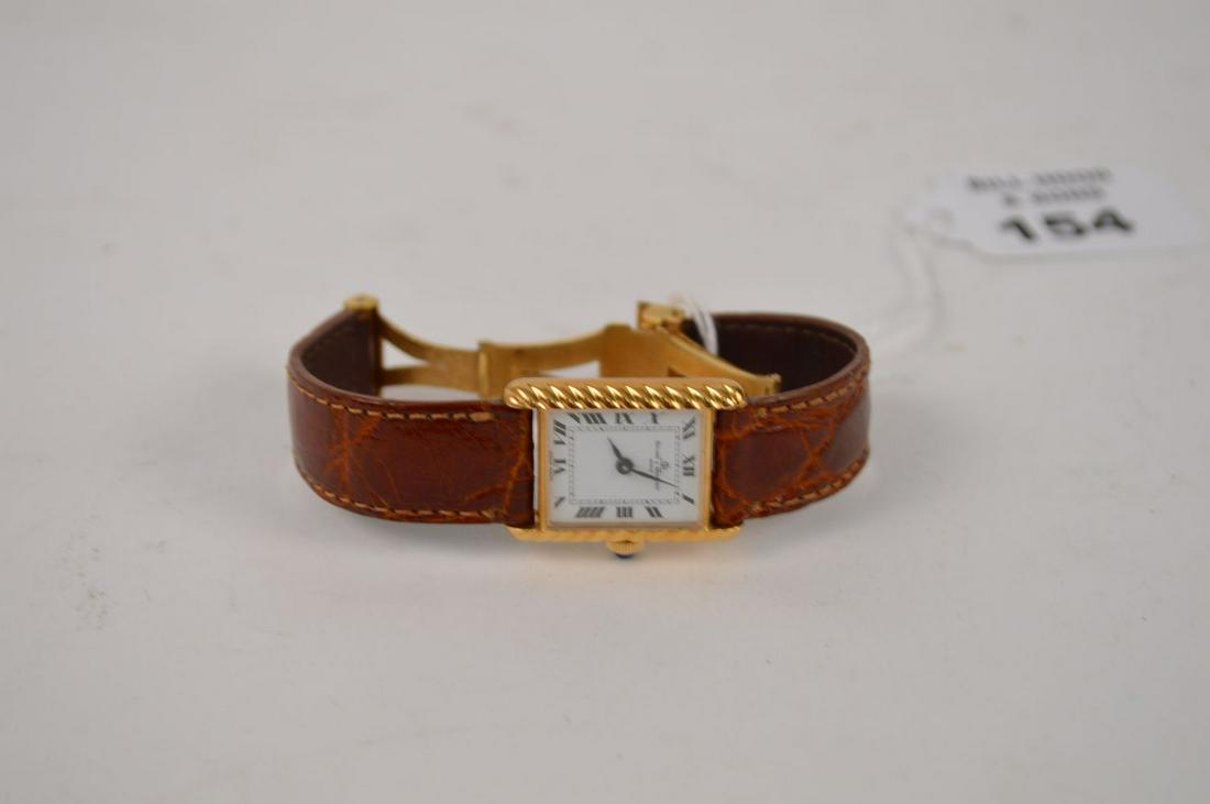 18k Yellow Gold Baume & Mercier Wrist Watch. 5" inner: 18k Yellow Gold Baume & Mercier Wrist Watch. 5" inner circumference with a 2.5" opening leather Band. Watch working, 18 x 22 mm