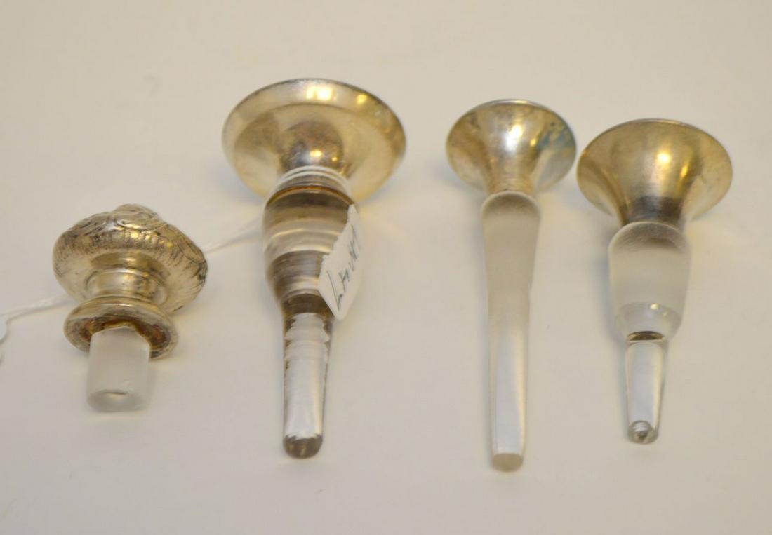 4 assorted perfume bottle stoppers, 3 with enameling: 4 assorted perfume bottle stoppers, 3 with enameling and silver tops, 3 1/2" longest (one stopper with chip)