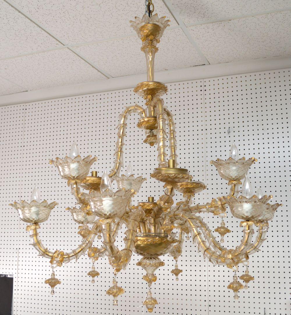 Venetian Glass Chandelier with 12 scrolled arms, gold: Venetian Glass Chandelier with 12 scrolled arms, gold accents and glass tassels, 49"h x 33"w (good condition)