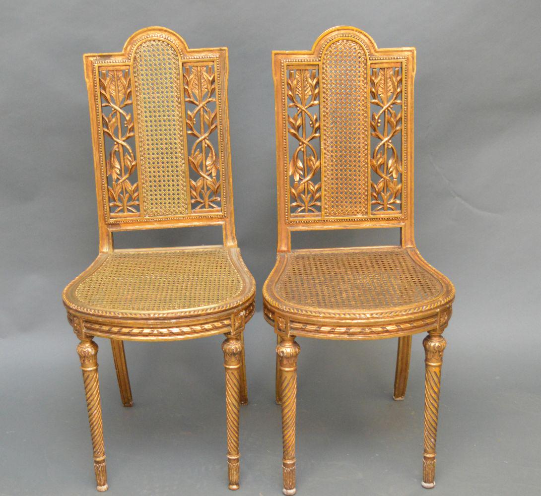 Pair gold cane & carved side chairs with pink cushions: Pair gold cane & carved side chairs with pink cushions