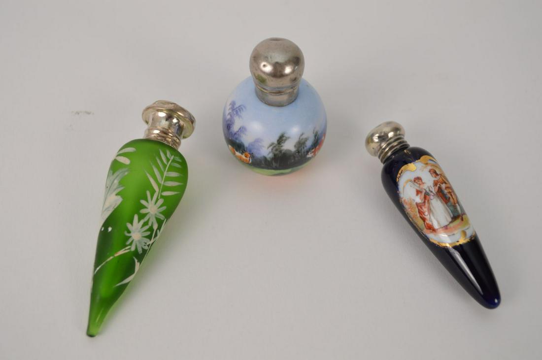 3 perfume bottles with silver tops, 2 glass and 1: 3 perfume bottles with silver tops, 2 glass and 1 porcelain, 3 1/4" L
