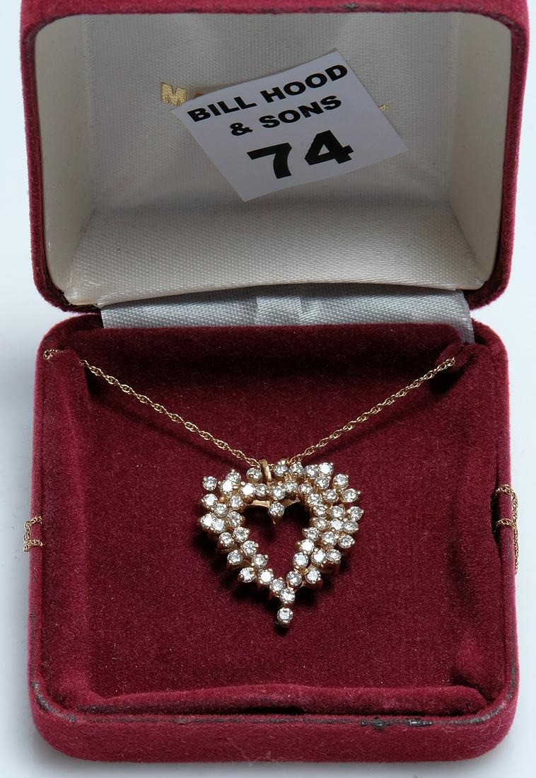 14kt yellow gold heart pendant with 1.2 carat diamond: 14kt yellow gold heart pendant with 1.2 carat diamond on 14kt chain (18"L), round brilliant cut prong set diamonds, lovely Deco style open center heart