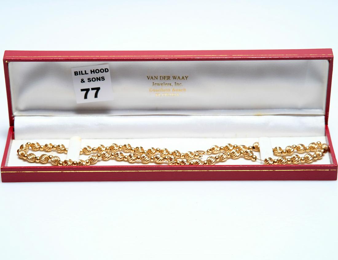 14kt yellow gold textured swirl and smooth bead: 14kt yellow gold textured swirl and smooth bead necklace (18 1/2"L), textured beads are 5mm smooth beads strung on 14kt chain with lobster clasp, 6.9 grams