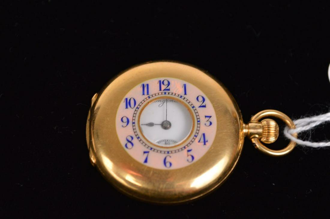 18k Yellow Gold Demi­hunter pocket watch, made: 18k Yellow Gold Demi­hunter pocket watch, made Longines, St. Imier, Switzerland, circa 1907. The straight barrel bridge is signed Longines with serial number 1774805. Condition: case ­ Few fine surf