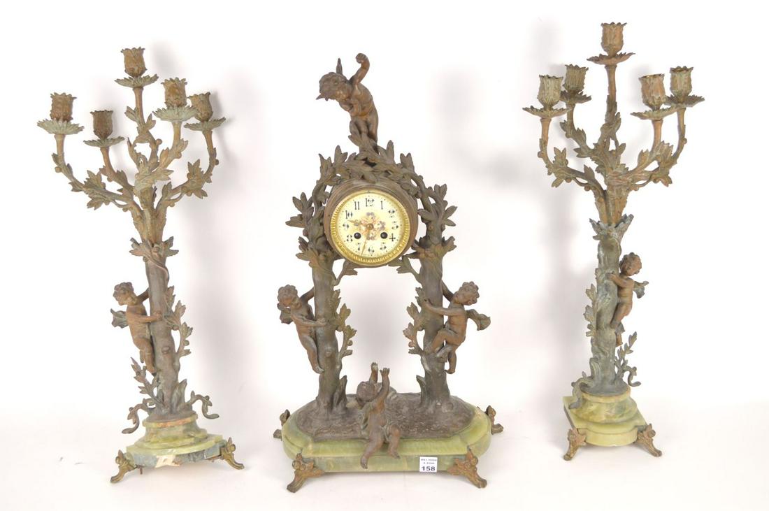 3 Pc. Garniture Set, 5 branch candelabra (26"h) and: 3 Pc. Garniture Set, 5 branch candelabra (26"h) and clock (25"h x 16"w), enamel face, Spelter and Onyx bases (Has damage, missing some feet)