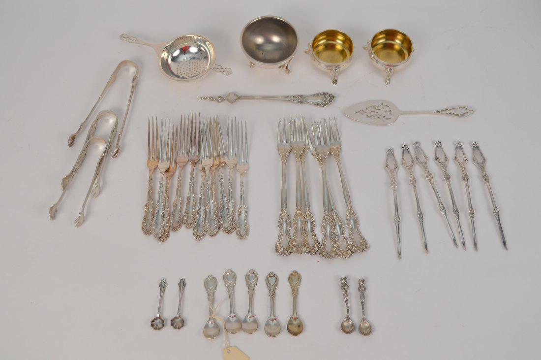 Sterling lot, incl; 17 Sterling Cocktail forks, 9 salt: Sterling lot, incl; 17 Sterling Cocktail forks, 9 salt spoons, 2 footed salt cellars, 3 sugar tongs (one is Tiffany), 6 picks, 2 pc. Tea strainer, condiment server and cork screw