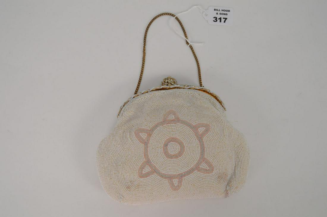 Exquisite Hand Beaded Evening Purse. Decorated with: Exquisite Hand Beaded Evening Purse. Decorated with genuine seed pearls and surrounded by old mine cut paste French rhinestones 7 ½” x 6 ½”. Good condition