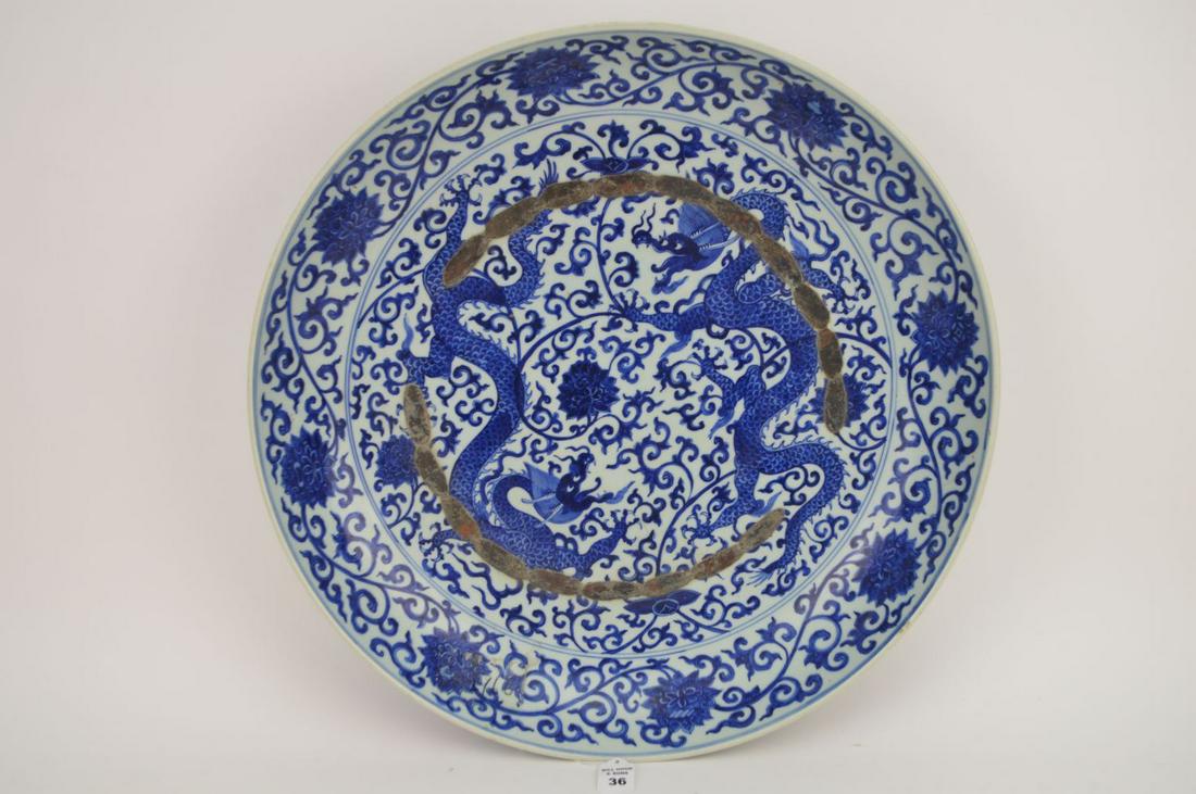 MONUMENTAL CHINESE BLUE & WHITE PORCELAIN MING DYNASTY: MONUMENTAL CHINESE BLUE & WHITE PORCELAIN MING DYNASTY STYLE CHARGER with applied metal decoration. Condition: no cracks or chips. Diameter 21 3/4"