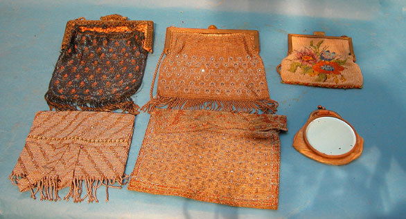 (3) antique beaded ladies bags: gold colored frame: (3) antique beaded ladies bags: gold colored frame with blue and clear glass beads on frame and in rows on mesh, blue and glass clasp with fringe at bottom; navy blue mesh with floral motif, reticulat
