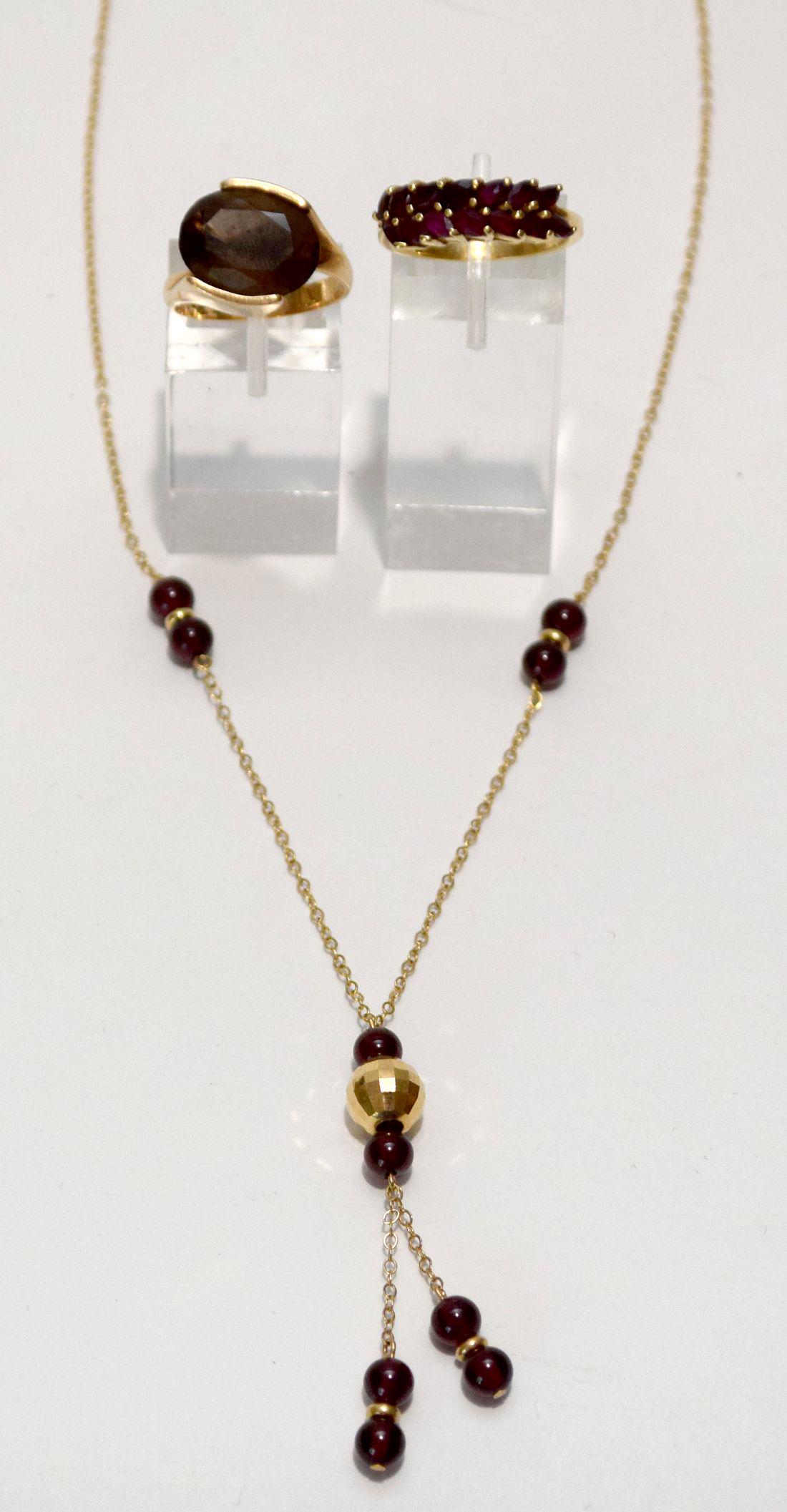 14K - 18K Yellow Gold Rings & Necklace. 2 Rings, 1 14k: 14K - 18K Yellow Gold Rings & Necklace. 2 Rings, 1 14k Quartz Size 7.25 and 1 18K Ruby Ring Size 7.5, Necklace 14K length 18". Total weight 13.8 grams
