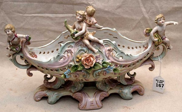 Porcelain bowl with 4 putti, 14"L x 9"h