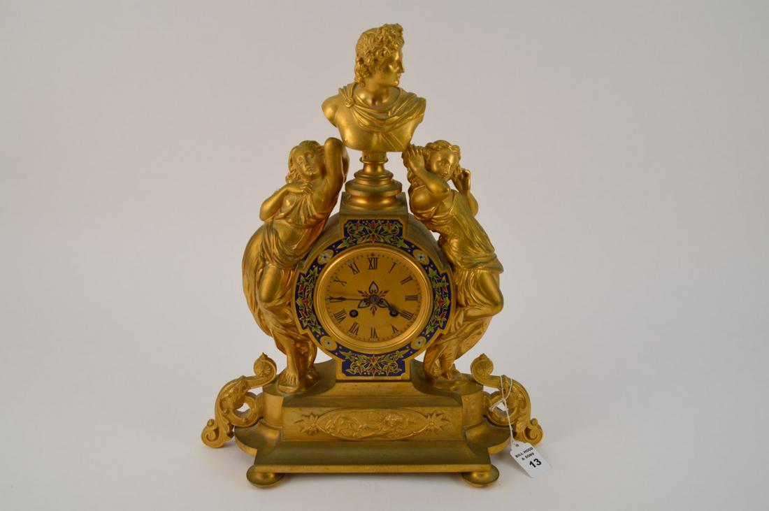 FRENCH GILT BRONZE & CHAMPLEVE FIGURAL CLOCK with time: FRENCH GILT BRONZE & CHAMPLEVE FIGURAL CLOCK with time and strike movement. Condition: good. Height 17" width 14" Depth 6"