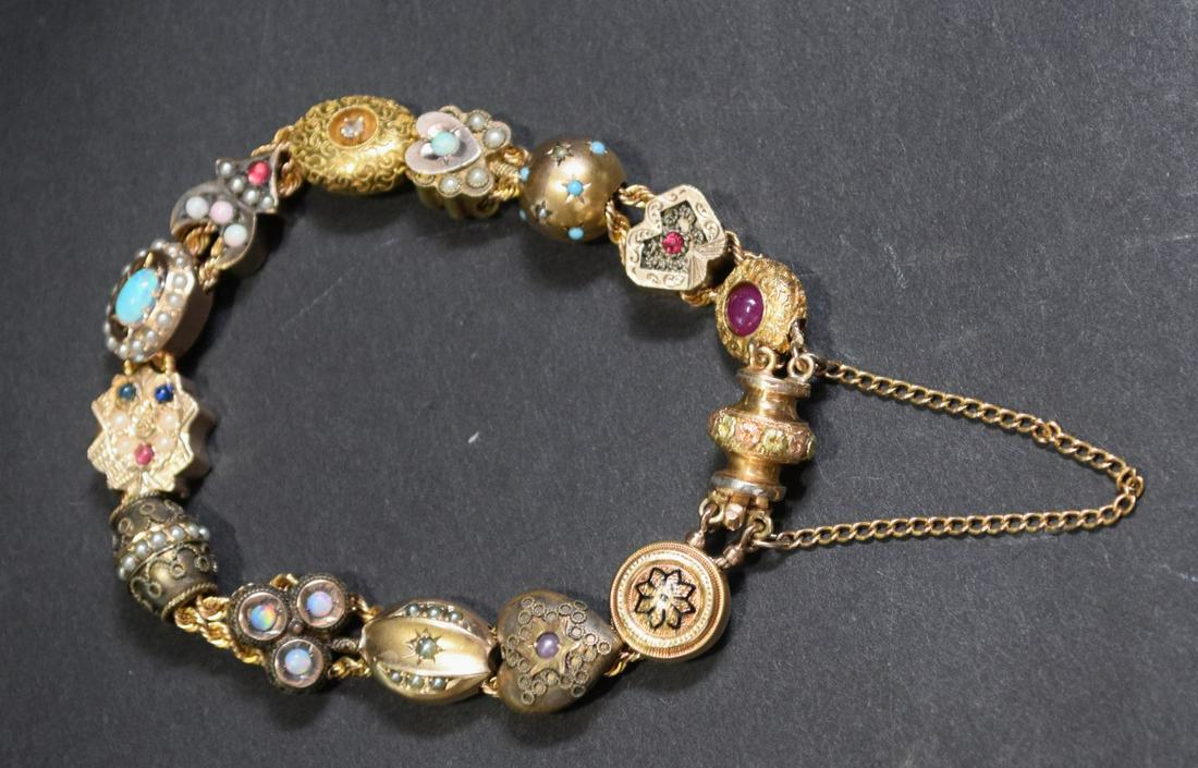 14K Yellow Gold Victorian Slide Bracelet. Size 6": 14K Yellow Gold Victorian Slide Bracelet. Size 6" with safety clasp. Weight 21 grams. 11 Gold slides and 3 gold filled.