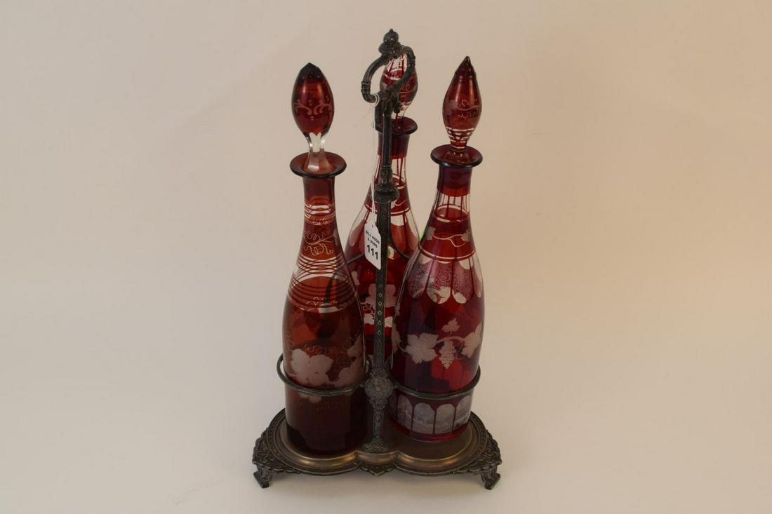 SILVER PLATED CRUET WITH 3 RUBY CUT TO CLEAR DECANTERS. (1 of 12)