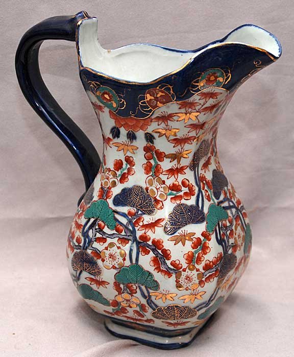 Pair of Mari decorated pitchers, 10 1/2"h: Pair of Mari decorated pitchers, 10 1/2"h