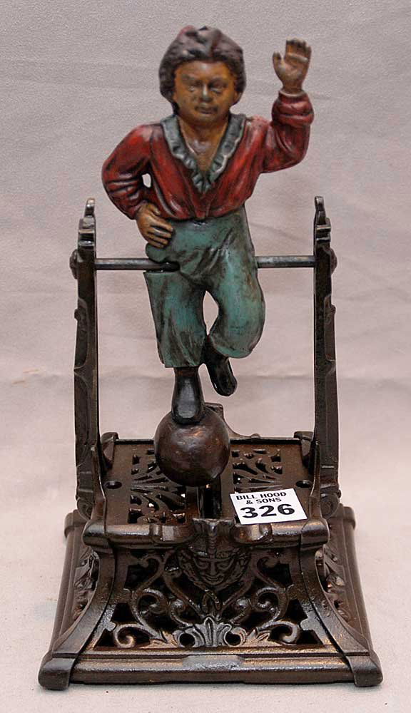 "Boy on Trapeze" cast iron mechanical bank, J. Ba: "Boy on Trapeze" cast iron mechanical bank, J. Barton Smith, circa 1888, 9"h x 5"l