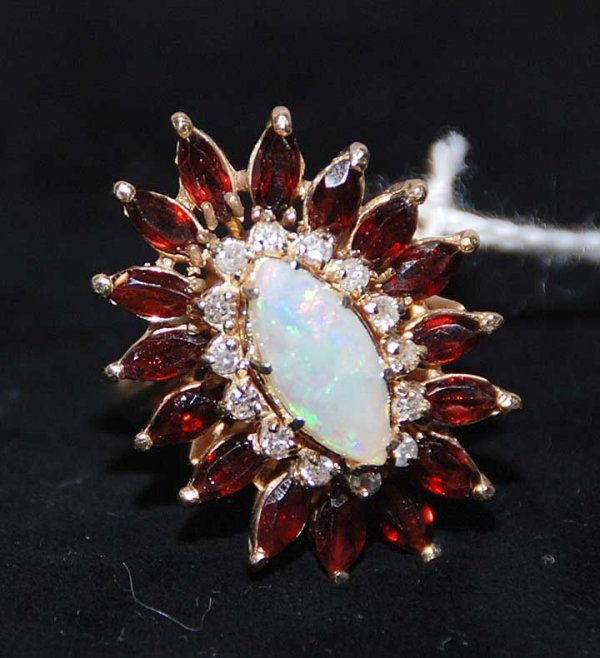 Marquis opal ring surrounded by 15 pts diamonds an: Marquis opal ring surrounded by 15 pts diamonds and marquise garnets set in 14K yellow