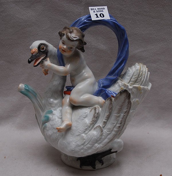 Meissen teapot with putti riding swan, beak with me: Meissen teapot with putti riding swan, beak with mend, 7"l x 8"h