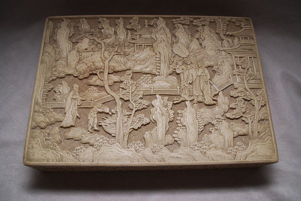White cinnabar carved Chinese wood box depicting h: White cinnabar carved Chinese wood box depicting house with figures in garden on top, 12 1/2"L x 9"w x 2 1/2"h