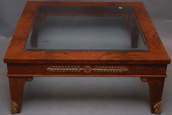 Burled wood square coffee table with beveled glass: Burled wood square coffee table with beveled glass and gold ornamental mounts, 42" x 42"