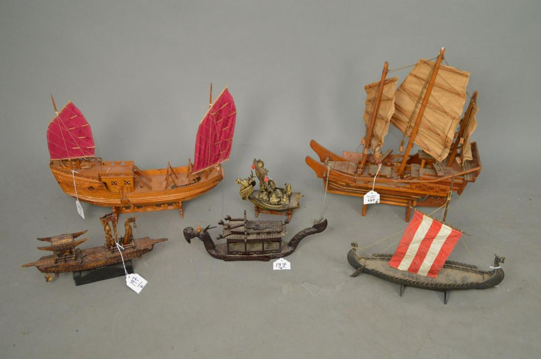 SIX DRAGON & ASIAN MODEL SHIPS OF VARIOUS MEDIUMS -: SIX DRAGON & ASIAN MODEL SHIPS OF VARIOUS MEDIUMS - Includes a wood dragon headed boat (loss to horn & roof edge) 14” L; a wood 2-mast boat with carved Phoenix decoration (loss to front of ship) 18�