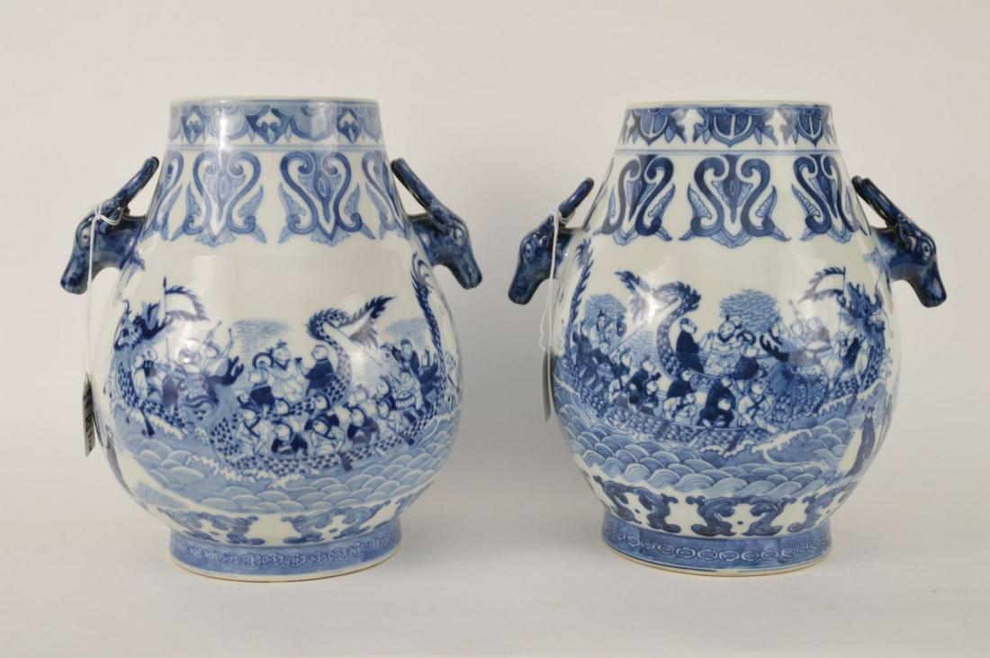 PAIR OF CHINESE BLUE & WHITE PORCELAIN VASES -: PAIR OF CHINESE BLUE & WHITE PORCELAIN VASES - Six-Character mark on bottom, Guangxi decoration. Figural stag handles Dimensions: 10” H. Condition: Minor normal wear.